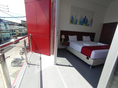 a bedroom with a bed on a balcony at HOTEL SAN JUAN, Tarapoto in Tarapoto