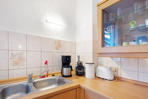 a kitchen with a sink and a counter top at Vogelsberger Bett 5 die 1 in Alsfeld