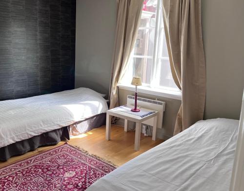 Tempat tidur dalam kamar di Sölje Herrgård Annexet