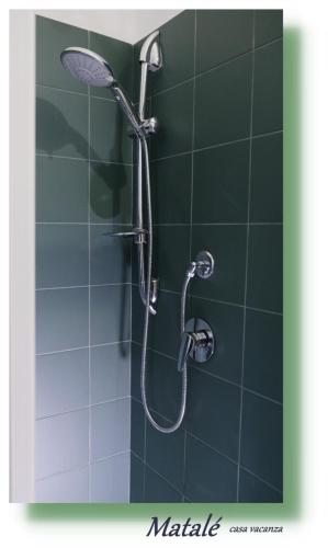 a shower with a shower head in a bathroom at Matalé - casa vacanze in Taranto