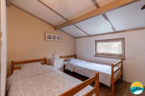 Postel nebo postele na pokoji v ubytování Zeevibes