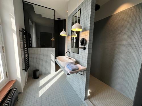 a bathroom with a sink and a mirror at Villa Ellerslie in Saint Malo