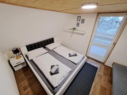Postel nebo postele na pokoji v ubytování Chatky Lesná