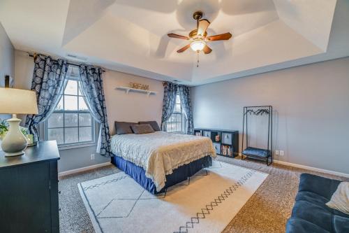 a bedroom with a bed and a ceiling fan at Family-Friendly Clarksville Home with Fire Pit! in Oak Grove