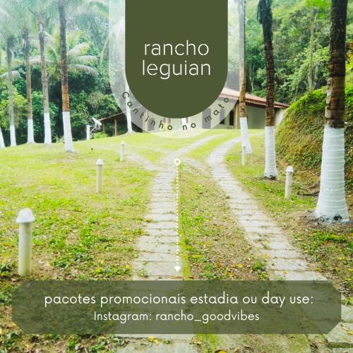 a road in a park with a sign that reads raminos lecuán at Rancho Leguian in Cachoeiras de Macacu