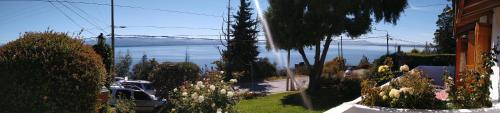a view of a street with a view of the ocean at Miralago I in San Carlos de Bariloche