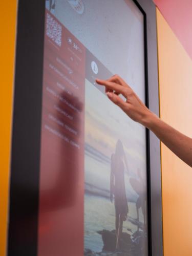 a person pointing at a projection screen at Sholeo Lodges Los Gigantes in Puerto de Santiago