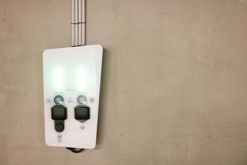a white electrical outlet on a wall at Campanile Limoges Centre - Gare in Limoges
