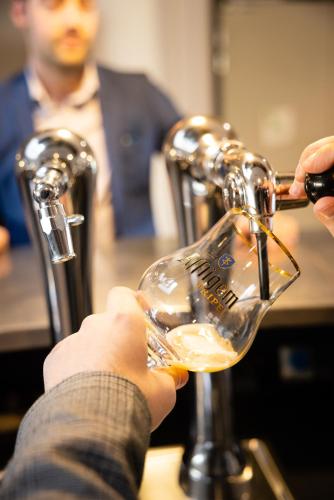 a person is drinking from a wine glass at Campanile Limoges Centre - Gare in Limoges