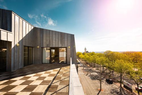 a view of a building from the balcony at Campanile Limoges Centre - Gare in Limoges