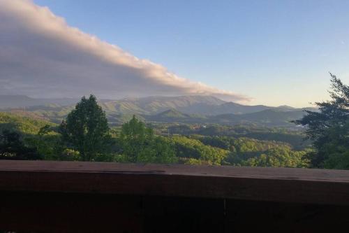 a view of a mountain with a rainbow in the sky at Yogi's Den: Breathtaking Views! 3 min to Dollywood, on 1 acre! in Sevierville