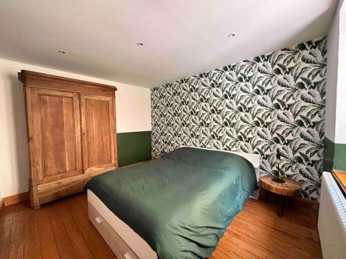 Ein Bett oder Betten in einem Zimmer der Unterkunft L’ancienne ferme