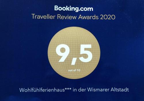 Signe indiquant que les prix de la revue de voyage sont au nombre de quatre-vingt-dix dans l'établissement Wohlfühlferienhaus - ABC198, à Wismar
