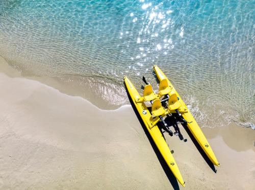 a pair of yellow rescue equipment on the beach at Porto Zante Villas And Spa in Tragaki