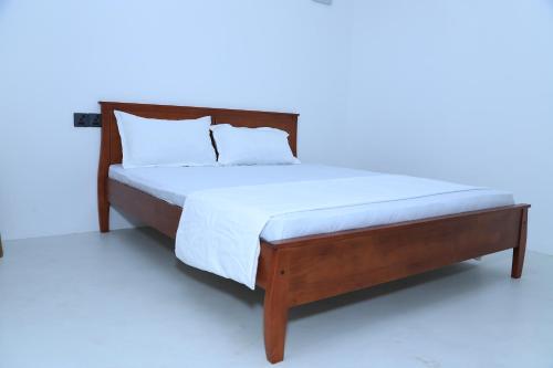 Postel nebo postele na pokoji v ubytování Palm Beach Resort Ceylon