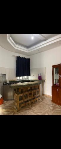 a kitchen with a stone counter in a room at Muhabura view imfizi farmhouse in Kisoro