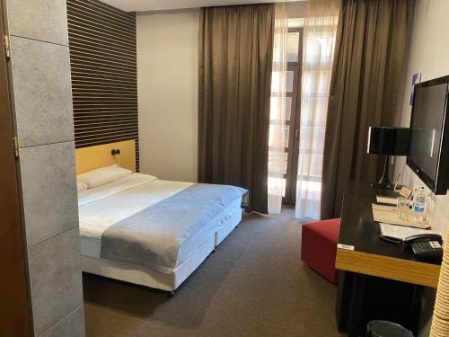 Ένα ή περισσότερα κρεβάτια σε δωμάτιο στο Park Hotel Switzerland