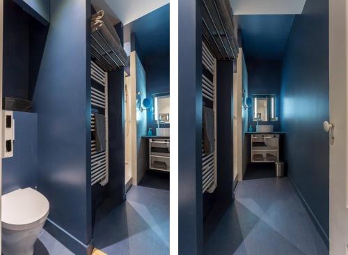 リヨンにあるCuriosité - 2 chambres- proche Opéraの青い壁のバスルーム(トイレ付)
