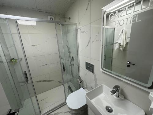 a bathroom with a shower and a sink at gazelle suites in Istanbul