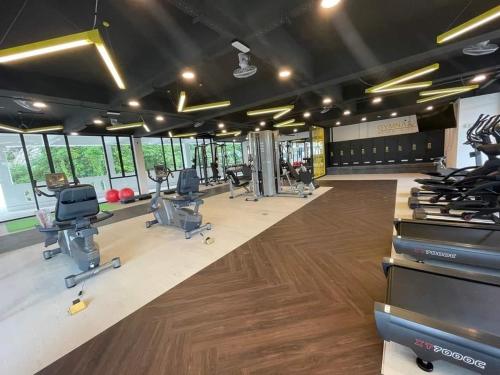 a gym with a lot of chairs and a lot of windows at IPOH TAMBUN THE COVE Your Ultimate Relaxation Getaway777 -3 BED ROOM -NO PETS ALLOW in Ipoh