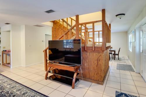 a home office with a desk and a wooden wall at Lake Days and Golf Outings Summerfield Group Escape in Summerfield