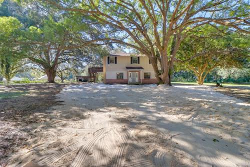 an empty driveway in front of a house with trees at Lake Days and Golf Outings Summerfield Group Escape in Summerfield