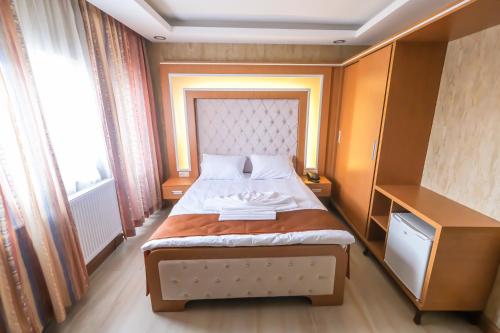 Postel nebo postele na pokoji v ubytování MİSSWAK HOTEL SORGUN