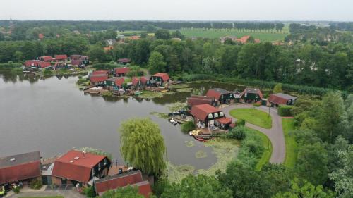 an aerial view of a village on a lake at Lakeside Cottage De Rijd in Nieuwe-Niedorp