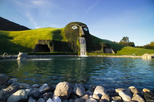 a fountain in the middle of a body of water at DSW Ferienhaus in Oberperfuss