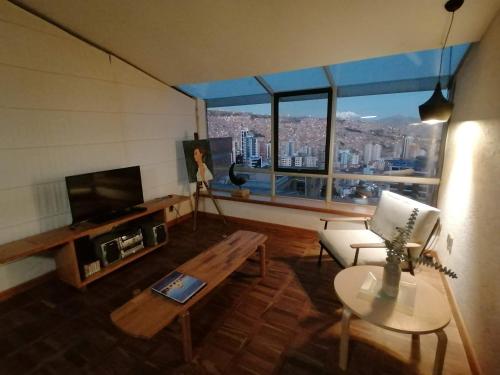 a living room with a view of a city at Villa Florita in La Paz