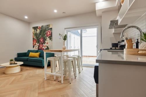 a kitchen and living room with a table and chairs at Spacious 2 bedroom apartment in Le Plateau by Denstays in Montréal