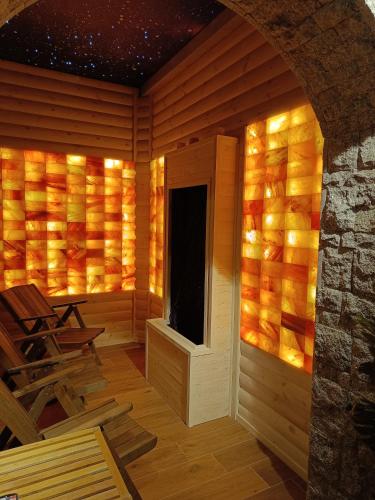a wooden room with a window and a chair at Willa Zielona Polana in Czarna Góra