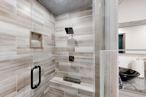 a bathroom with a shower with a glass door at Roswell Radiance in Roswell