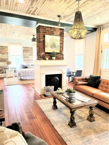 a living room with a couch and a fireplace at Kelley House in Pensacola