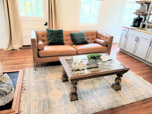a living room with a couch and a coffee table at Kelley House in Pensacola