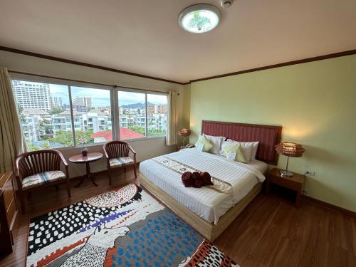 Кровать или кровати в номере Thipurai Beach Hotel