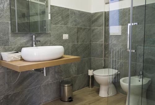 a bathroom with a sink and a toilet at Apartment Laghée in Bellano