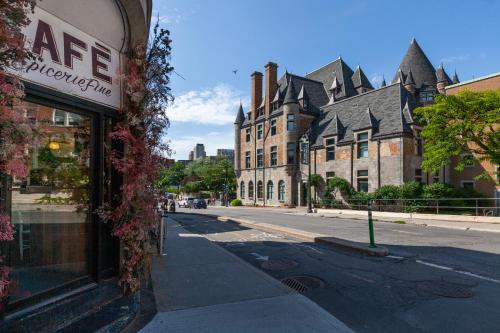 an empty street in a town with buildings at Hyatt Centric Montreal in Montréal