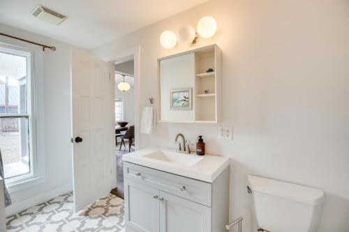 a white bathroom with a sink and a toilet at Pet-Friendly Montrose Home, Walk to Town! in Montrose