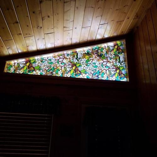a stained glass window on the ceiling of a room at Beary Tale! Your happily ever after starts here! in Sevierville