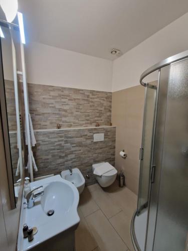a bathroom with a toilet and a sink and a shower at B&B La Loggia Del Castello in Trento
