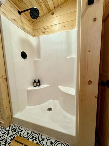 a small bathroom with a shower in a room at Brook Haven Retreat - Minutes to Mt Snow / Stratton, Pet Friendly! in Wardsboro