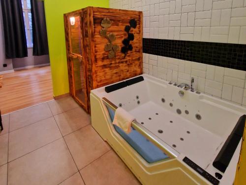 a bathroom with a jacuzzi tub in a room at Apartamenty Toskania No.4 Jacuzzi & Sauna in Poznań