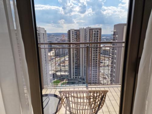 a view of a city from a balcony at Beograd na vodi - BW AURORA LUXURY in Belgrade