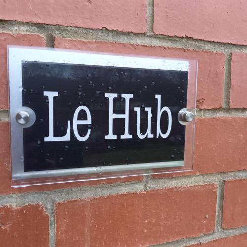 a sign on a brick wall with the words ice hub at City Hideaway in Leeds in Leeds