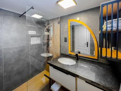 a bathroom with a sink and a mirror at Kybele Holiday Village in Kyrenia