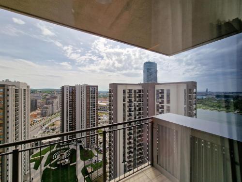 a balcony with a view of a city at Beograd na vodi - BW AURORA LUXURY in Belgrade