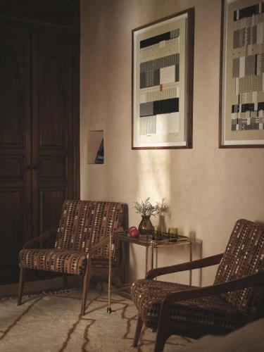 a living room with two chairs and a table at IZZA Marrakech in Marrakech