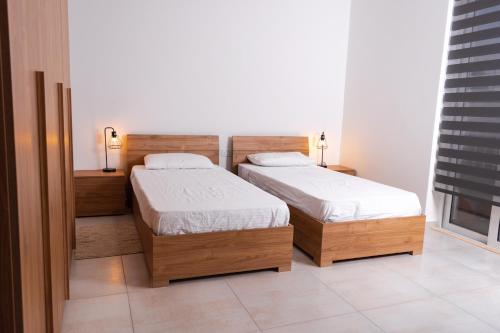 Ein Bett oder Betten in einem Zimmer der Unterkunft Azure FOUR