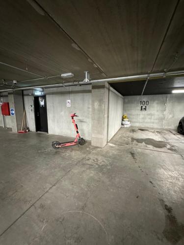 a scooter is parked in a parking garage at AArhus 115 in Aarhus